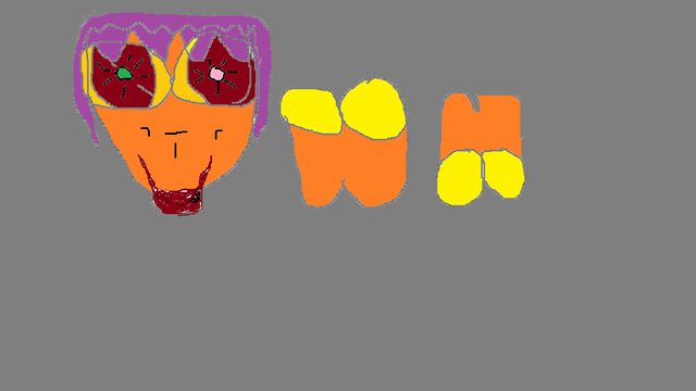 A found painted face with purple hair and green- and pink-centered eyes, beside orange-yellow letter shapes